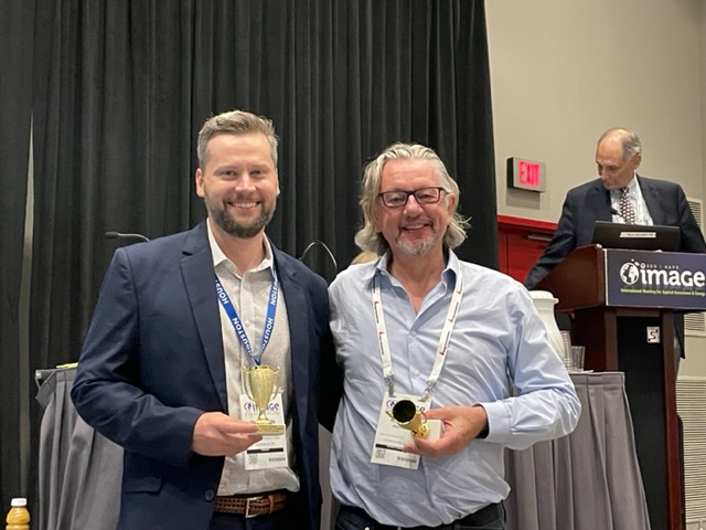 Ben Kirkland (CNOOC) and Andy Pepper (Consultant and CBTH collaborator) receiving an award for their paper in the Deepwater Sedimentary System volume at the Image meeting, August, 2022.