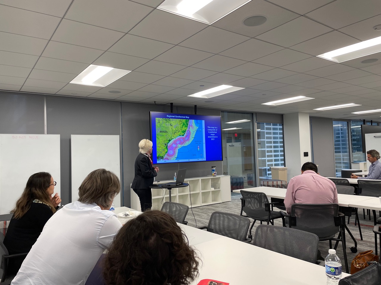 Dr. Sharon Cornelius (CBTH post-doctoral researcher) presents her regional mapping of the Campos-Santos basin of Brazil at the office of TotalEnergies in December 2022. 